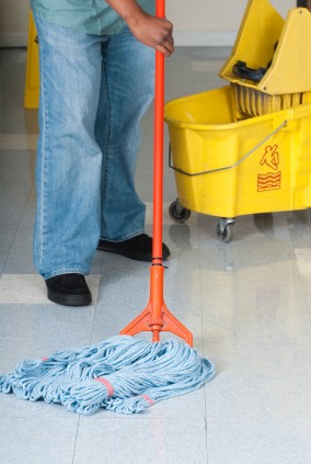 Indiana Services LLC janitor in Indianapolis, IN mopping floor.